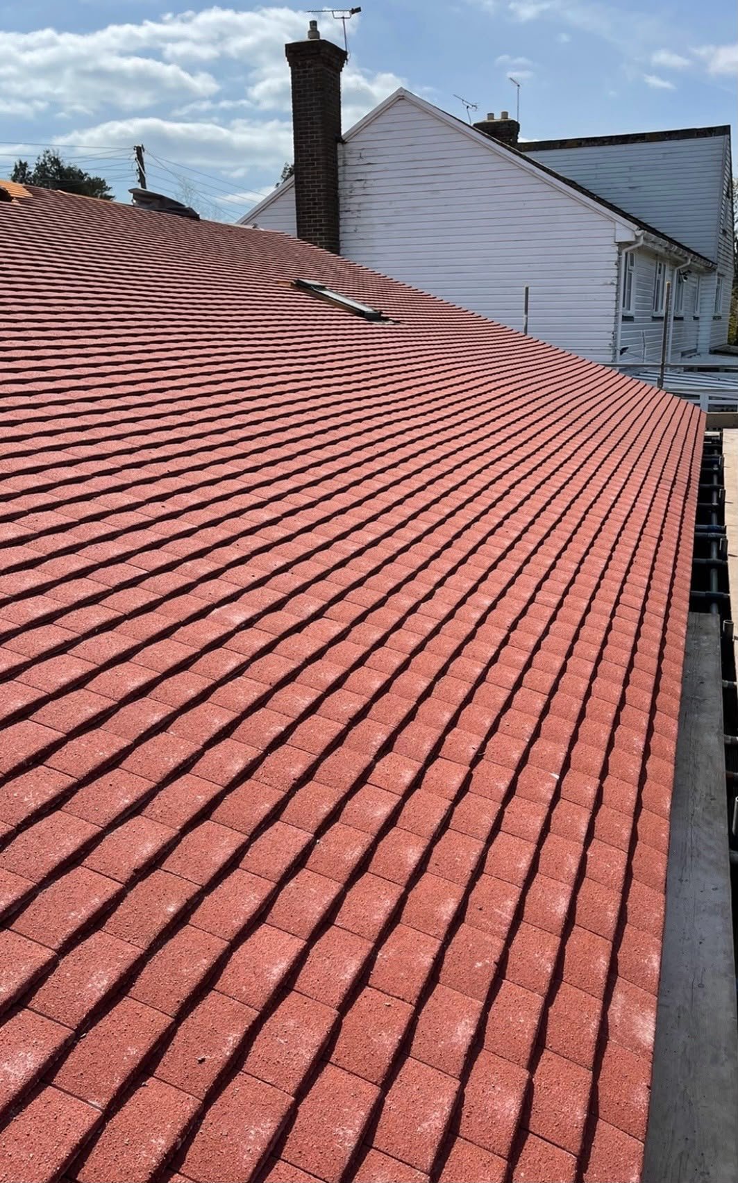 Close-up of rows of new red roof tiles