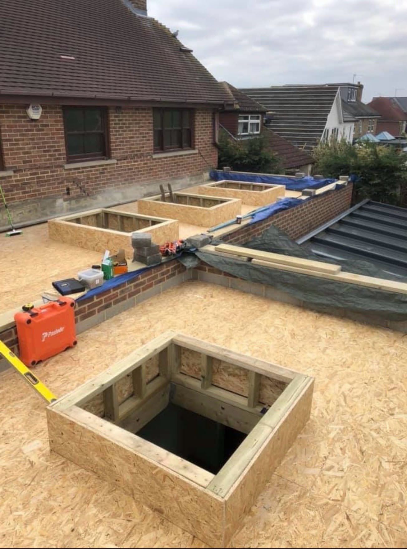New timber flat roof deck with upstands framed for roof lanterns